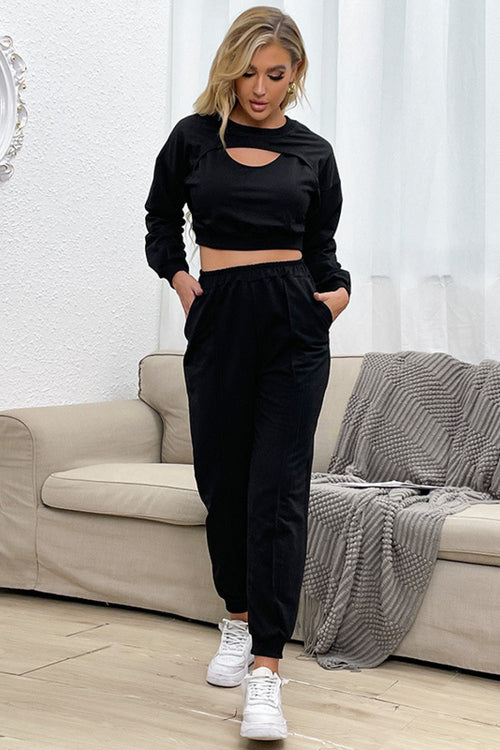 Stay stylish and comfortable in our trendy Cut Out Crop Top and Joggers Set. Perfect for a relaxed fit, this lounge wear is a must-have in your wardrobe. Available in the United States.