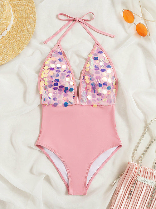 Stand out in style with our Women Pink Sequin One Piece Swimsuit. This trendy swimwear features sequin detailing, wire-free support, and a mid-waist fit. Available at Apparel Base.