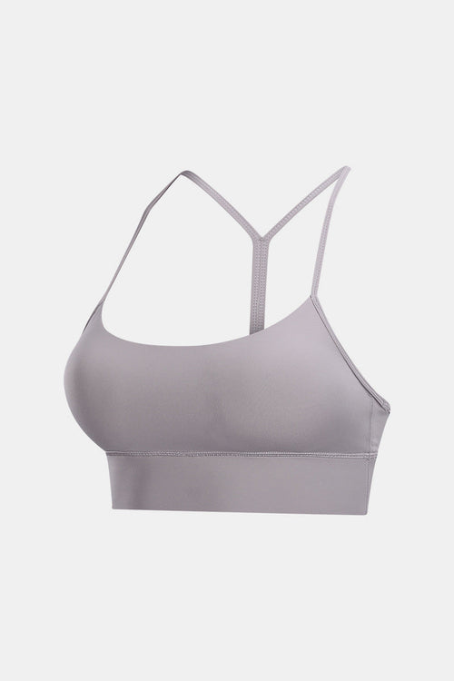 Experience comfort and style with our Y-Back Yoga Bra Tops. These wireless bras with removable padding and a spaghetti strap neckline offer a tight fit for your active lifestyle. Crafted from 80% nylon and 20% spandex, they provide flexibility and are machine washable. Perfect for yoga and fitness wear.