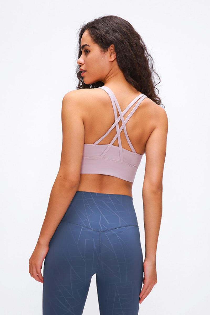 Double X Sports Bra in basic colors - Seamless design with an eye-catching double X strappy back for ultimate style and support. Crafted from 87% nylon and 13% spandex. True to size, machine washable, and perfect for elevating your workout wardrobe. Available from Apparel Base for the active and stylish woman.