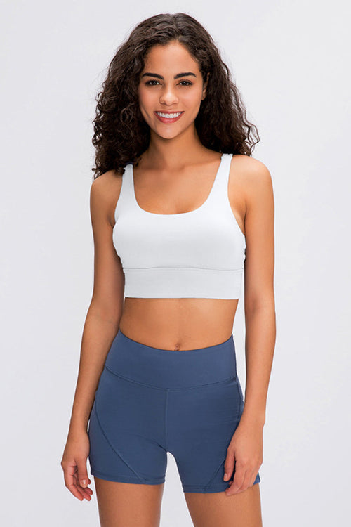 Double X Sports Bra in basic colors - Seamless design with an eye-catching double X strappy back for ultimate style and support. Crafted from 87% nylon and 13% spandex. True to size, machine washable, and perfect for elevating your workout wardrobe. Available from Apparel Base for the active and stylish woman.