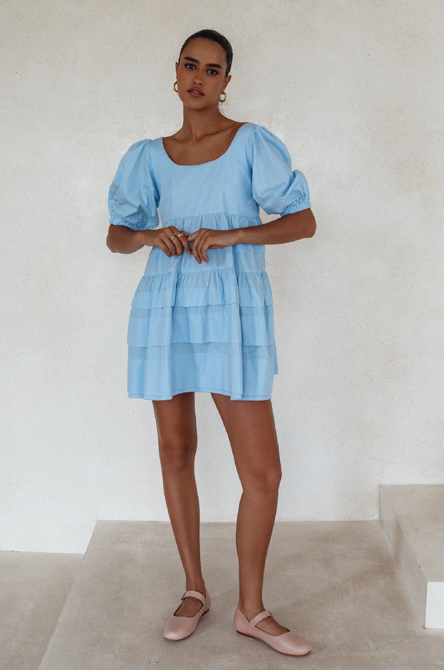 Andrea Babydoll Cotton Mini Dress - Handmade from breathable poplin cotton. Voluminous sleeves and a flattering neckline for chic comfort. Perfect for any occasion. Available in various sizes.