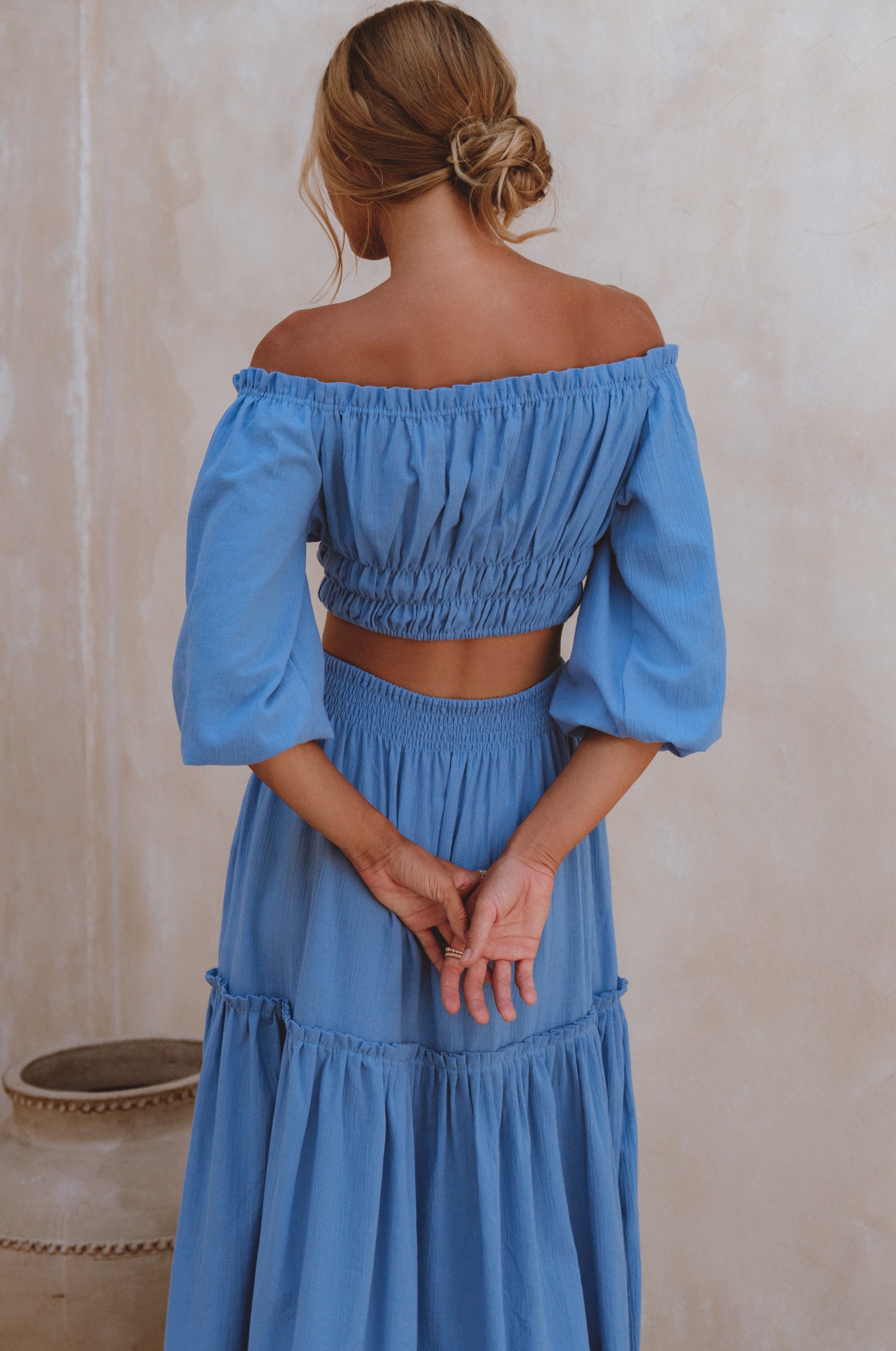 Explore the Annabelle Linen Cropped Top, a must-have in your wardrobe. Handcrafted from high-quality linen, it offers comfort and style. Pair with the matching maxi skirt or your favorite denim for a chic look.