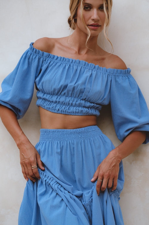 Embrace comfort and style with the Annabelle Linen Cropped Top. Handcrafted from high-quality linen, it features elasticated details for a perfect fit. Ideal for creating a feminine and romantic look when paired with the coordinating maxi skirt or styled with your favorite denim.