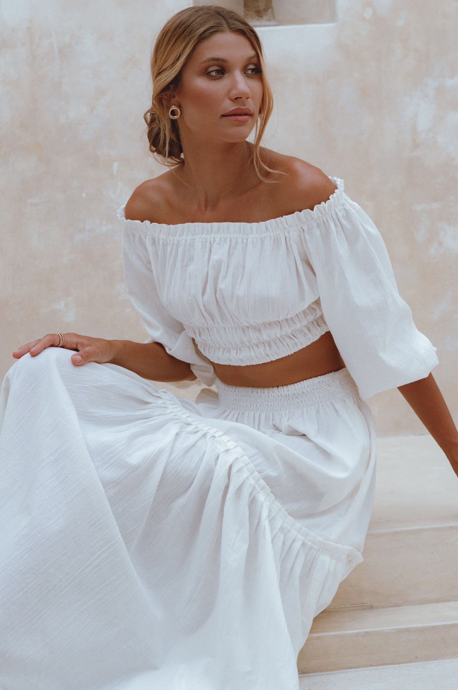 Explore the Annabelle Linen Cropped Top, a must-have in your wardrobe. Handcrafted from high-quality linen, it offers comfort and style. Pair with the matching maxi skirt or your favorite denim for a chic look.