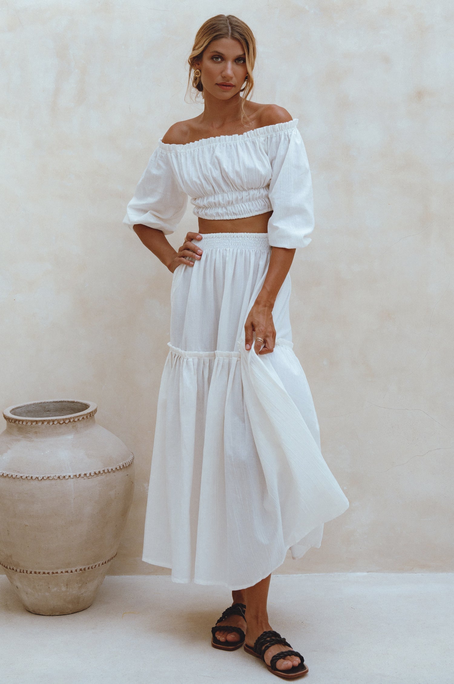 Explore the Annabelle Linen Cropped Top, a must-have in your wardrobe. Handcrafted from high-quality linen, it offers comfort and style. Pair with the matching maxi skirt or your favorite denim for a chic look.