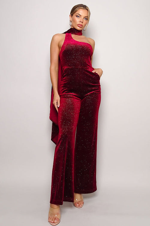 Embrace glamour in our Burgundy Glitter Velvet Jumpsuit with a chic scarf top. Perfect for a night out, this sleeveless one-shoulder outfit ensures style and comfort. Available now in the United States.