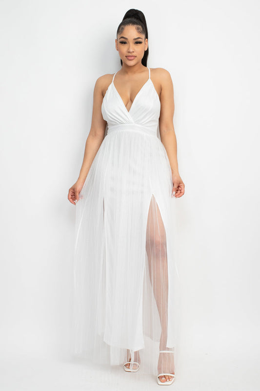 Elevate your style with the Pleated Mesh Slit Maxi Dress. This bold fashion-fit design showcases a v-neckline, crossed back, and front slit, all enhanced by pleated details and a mesh overlay. The dress is crafted from 100% Polyester in a stunning white hue. 