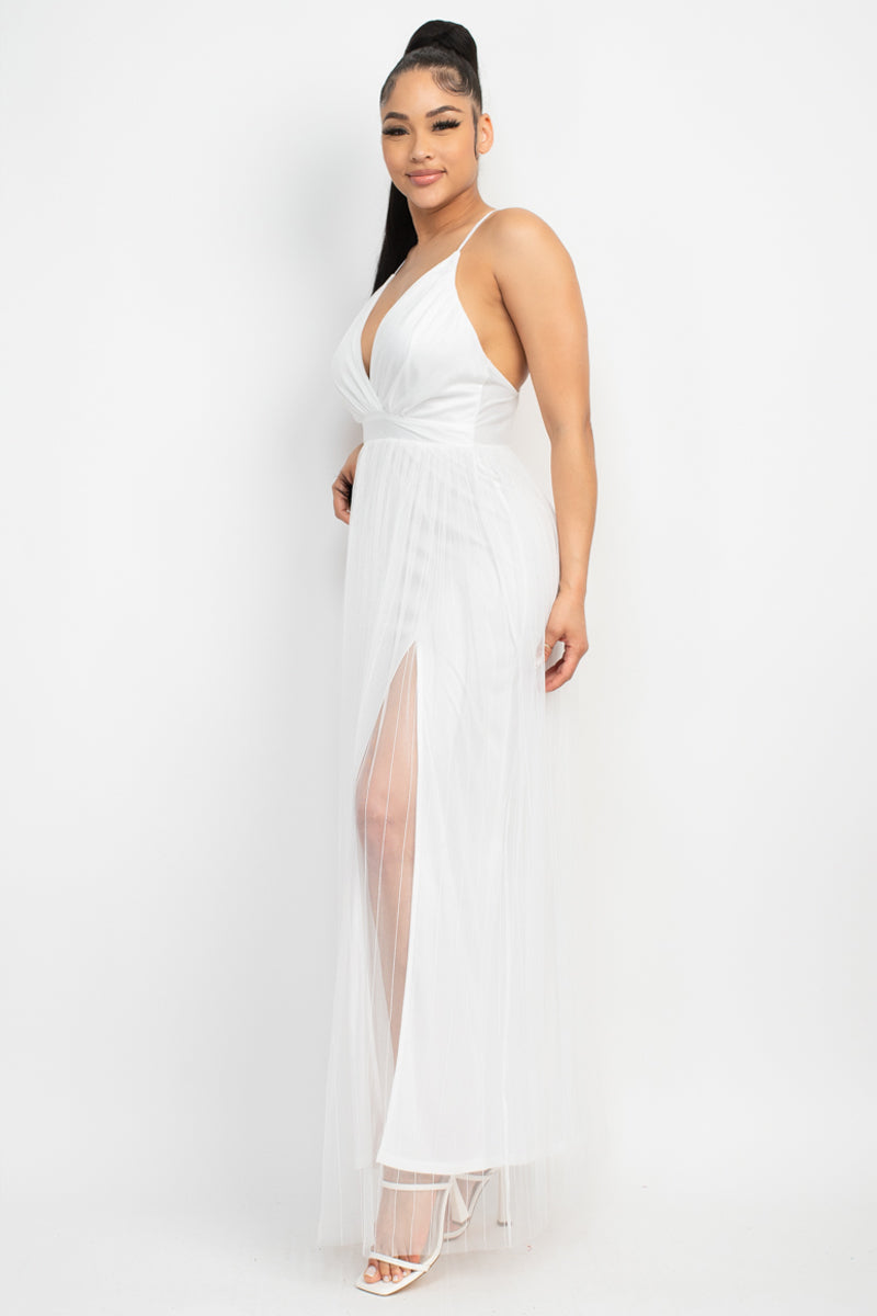 Elevate your style with the Pleated Mesh Slit Maxi Dress. This bold fashion-fit design showcases a v-neckline, crossed back, and front slit, all enhanced by pleated details and a mesh overlay. The dress is crafted from 100% Polyester in a stunning white hue. 