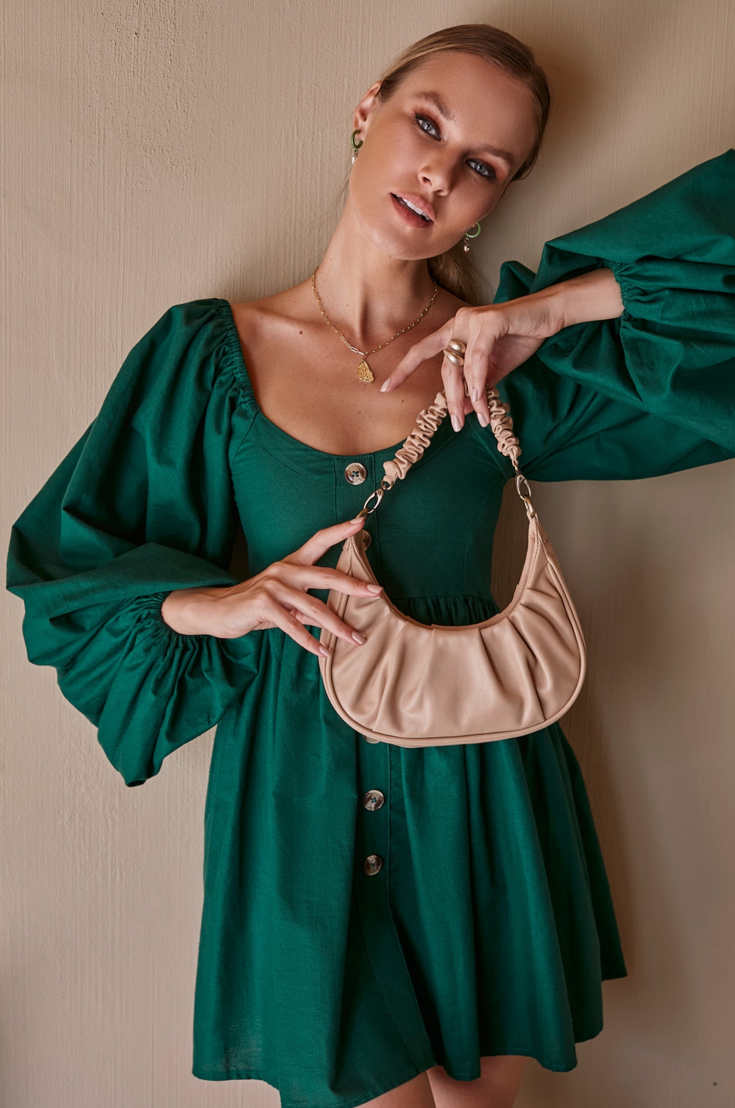 Experience effortless charm with the Chloie Empire Waist Linen Mini Dress. Designed with gorgeous long puff sleeves, a smocked square shape back, and elasticated sleeves, this easy-to-wear dress is perfect for any occasion. 