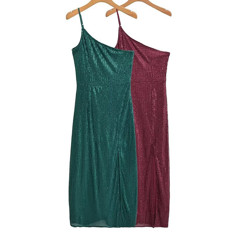 Step into elegance with our One-Shoulder Sequin Asymmetrical Midi Dress. Shimmering sequins, a chic oblique shoulder, and an asymmetrical hem make it perfect for special occasions. Available in sizes S, M, and L.