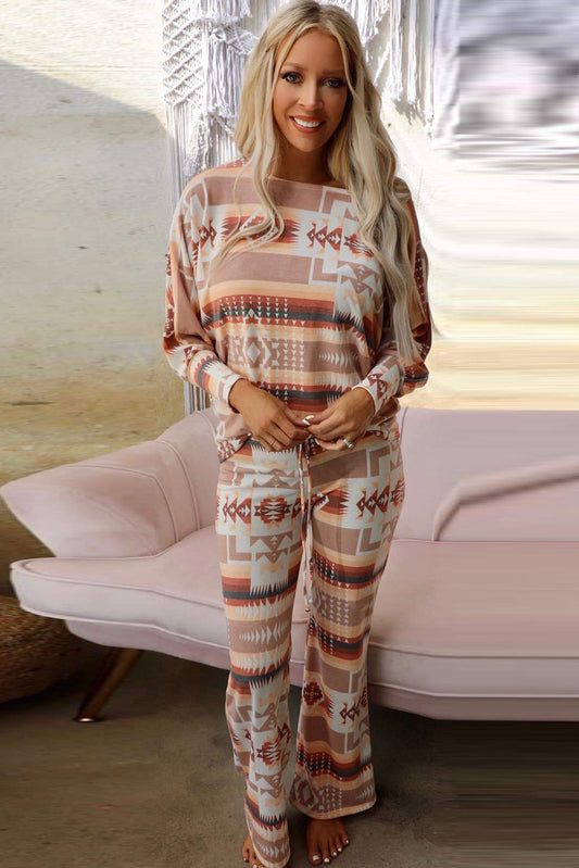 Embrace comfort and style with our Diamond Print Home Wear. This ensemble, designed for women, features a trendy diamond pattern. The long sleeve top and matching long pants are perfect for staying cozy during the fall and winter seasons.