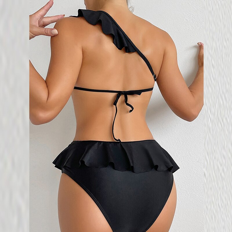 Elevate your beach style with the One Piece One Shoulder Hollow Swimsuit Bikini from Apparel Base. This elegant swimwear provides the perfect blend of fashion and comfort. Ideal for your next swim adventure.