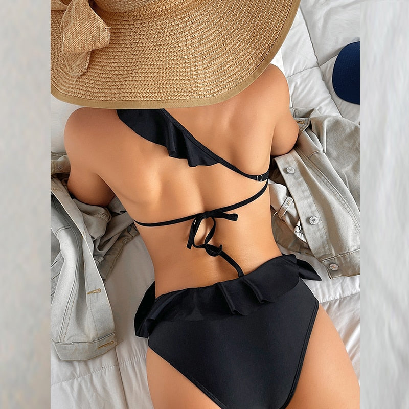 Elevate your beach style with the One Piece One Shoulder Hollow Swimsuit Bikini from Apparel Base. This elegant swimwear provides the perfect blend of fashion and comfort. Ideal for your next swim adventure.