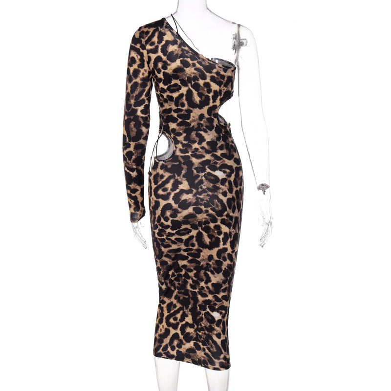 Capture attention in our Sexy Bandage Cut Out Leopard Print Midi Dress. The sheath silhouette, V-neckline, and ankle-length design create a bold and stylish look. 