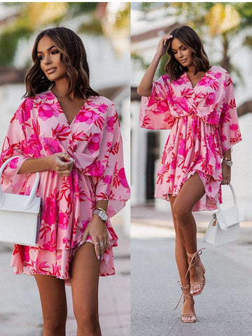 Chic V-neck Mini Dress for beach parties. Batwing sleeves, vibrant print, and A-line silhouette. Elevate your style effortlessly. Shop now!