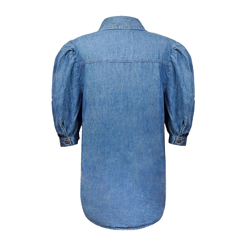 Embrace style with our Puff Sleeve Elegant Turn-down Collar Denim Top. Made from a comfortable blend of cotton and polyester. Perfect for women's fashion in the United States.