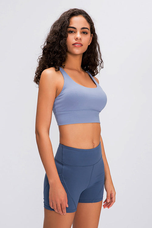 Double X Sports Bra in basic colors - Seamless design with an eye-catching double X strappy back for ultimate style and support. Crafted from 87% nylon and 13% spandex. True to size, machine washable, and perfect for elevating your workout wardrobe. Available from Apparel Base for the active and stylish woman.