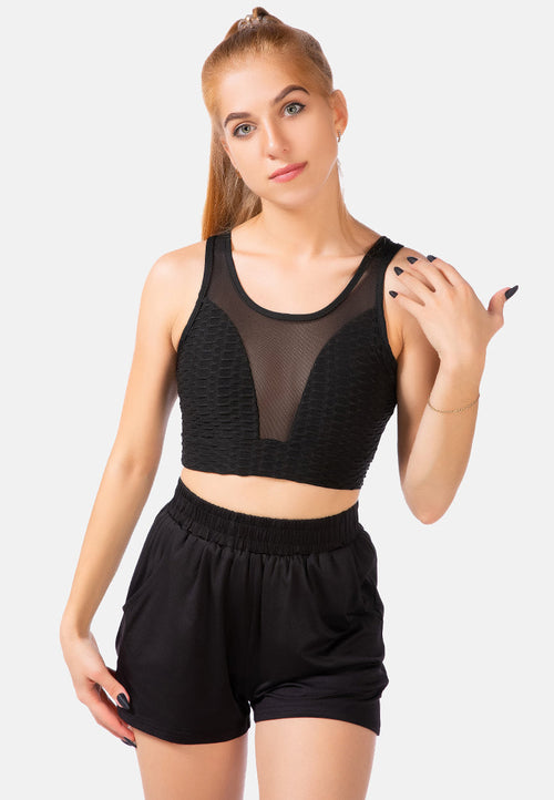 Active Sports Mesh Bra with textured knit fabric and sheer panels. Ample support and stylish design. Skinny fit, scoop neck, and stretchable for comfort. Ideal for workouts and athleisure. Model wears US S / UK 6. Shop now for the perfect fitness fashion - CLG8350.