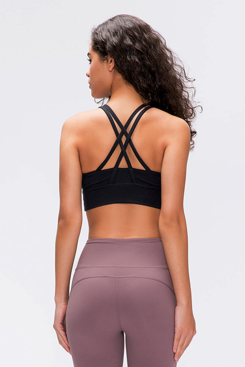 Double X Sports Bra in basic colors - Seamless design with an eye-catching double X strappy back for ultimate style and support. Crafted from 87% nylon and 13% spandex. True to size, machine washable, and perfect for elevating your workout wardrobe. Available from Apparel Base for the active and stylish woman.