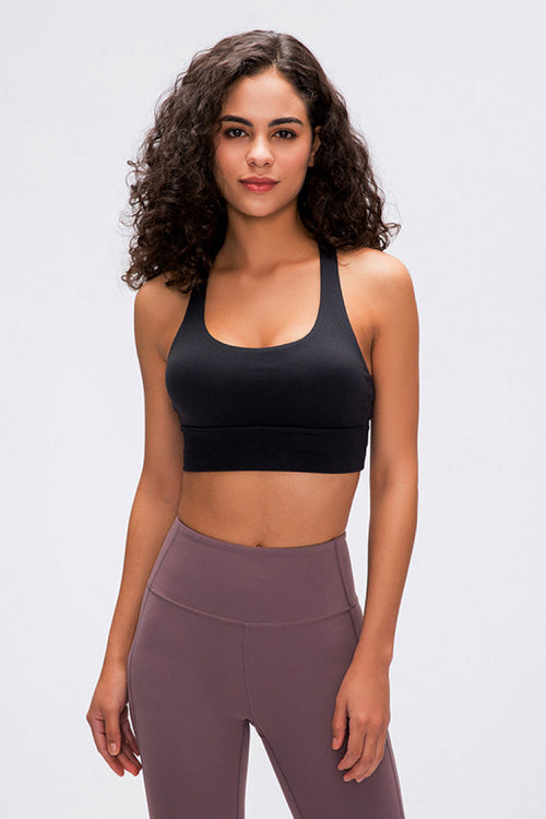 Double X Sports Bra in basic colors - Seamless design with an eye-catching double X strappy back for ultimate style and support. Crafted from 87% nylon and 13% spandex. True to size, machine washable, and perfect for elevating your workout wardrobe. Available from Apparel Base for the active and stylish woman.