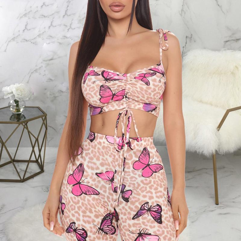  Explore the allure of our Butterfly Leopard Print Crop Top and Flare Pant set. Spaghetti straps, high waist, and a stunning print. Perfect for a fashionable look. Available in sizes S to XXL.