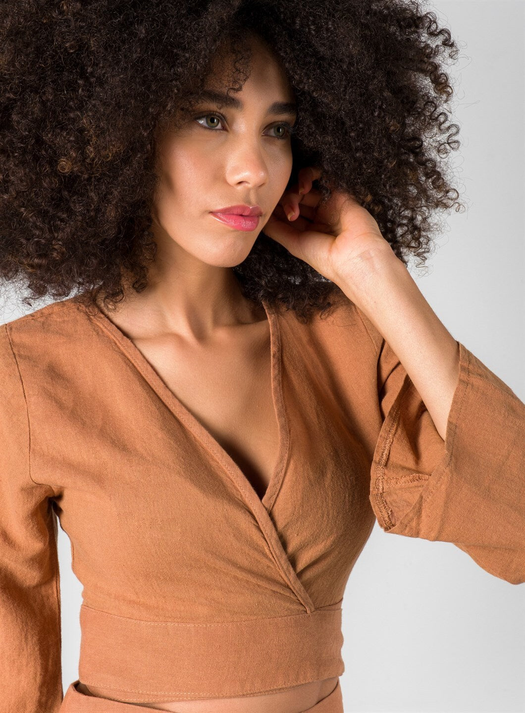 Explore the Organic Sustainable Cotton Boho Wrap Crop Top – a blend of linen and cotton for eco-friendly fashion. Perfect for a natural and chic look. Available in the United States.