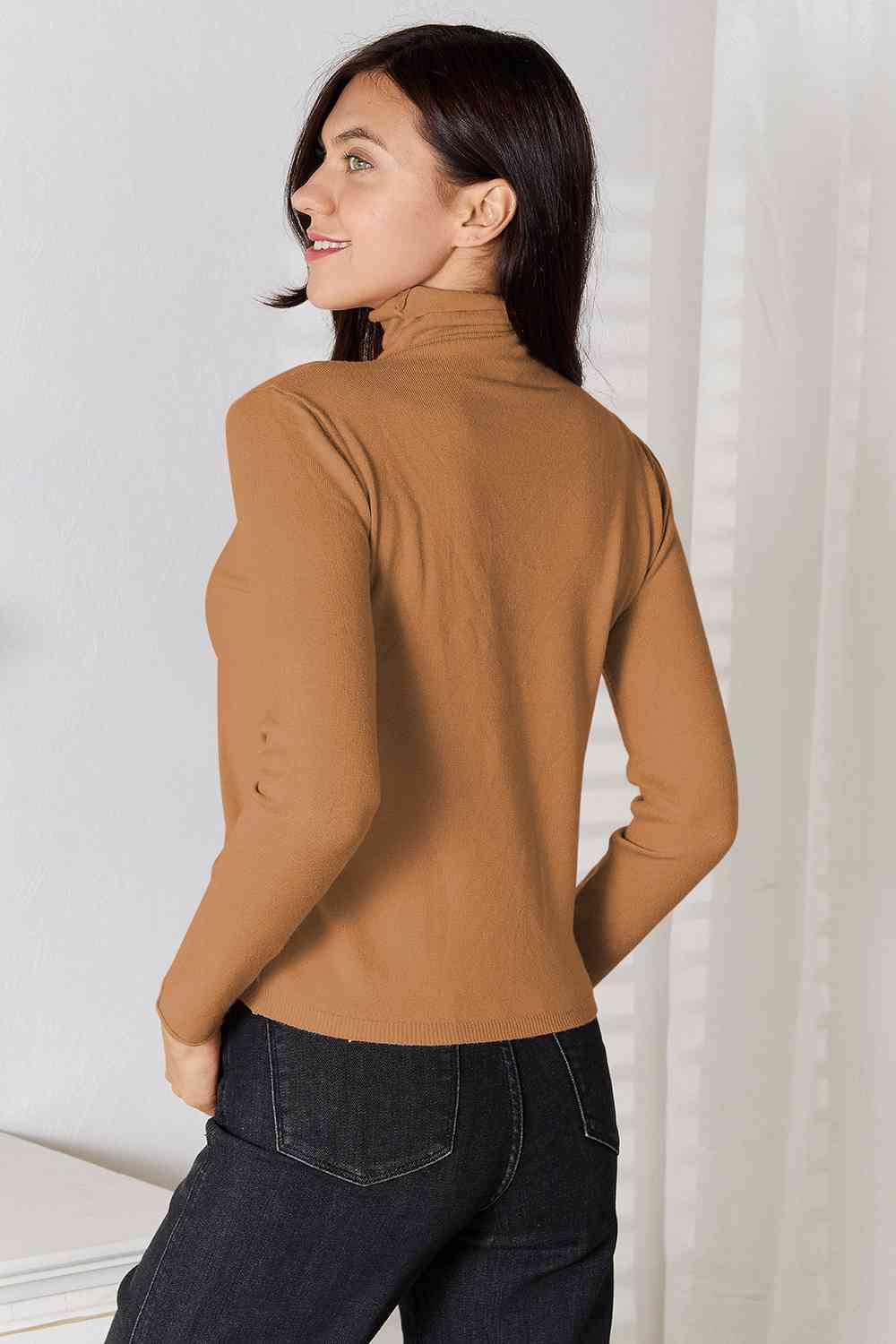 Stay cozy and stylish in our Turtleneck Long Sleeve Knit Top. Essential knitwear made from a blend of viscose and wool. Slightly stretchy for comfort. Machine washable. Available in sizes S to 2XL.