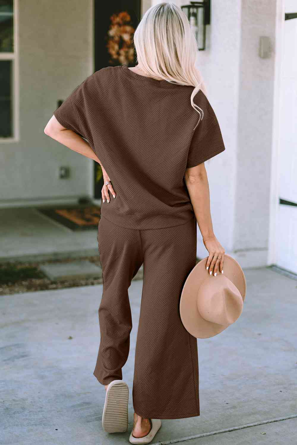 Stay comfortable and stylish in our Short Sleeve Top and Pants Set. Two-piece lounge wear made from a blend of polyester and spandex. Features a drawstring for a customizable fit. Available in sizes S to 2XL.