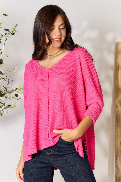 Zenana Full Size Round Neck High-Low Slit Knit Top. Made from a blend of polyester, rayon, and spandex. Highly stretchy for all-day comfort. Available in various sizes.