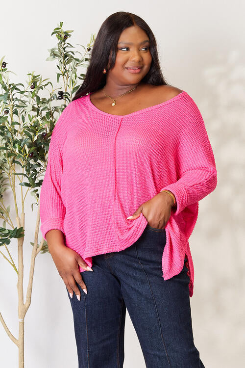 Zenana Full Size Round Neck High-Low Slit Knit Top. Made from a blend of polyester, rayon, and spandex. Highly stretchy for all-day comfort. Available in various sizes.