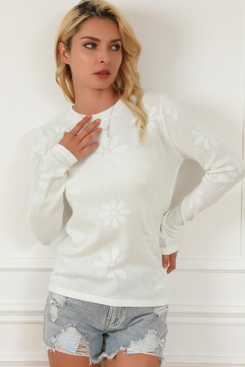  Floral Eyelet Long Sleeve Knit Top in a blend of viscose, polyester, and nylon. 