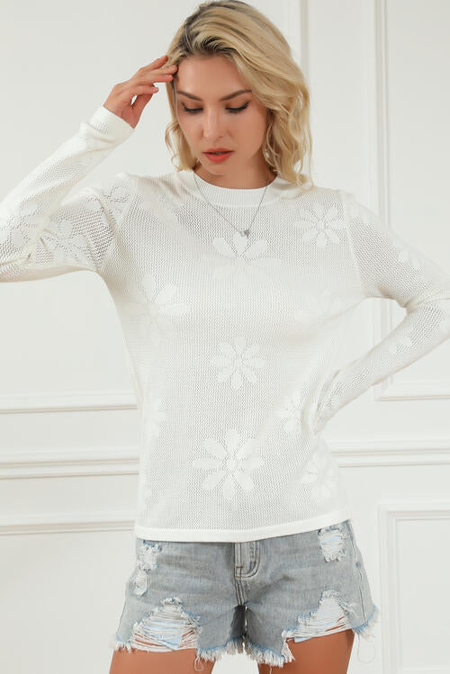  Floral Eyelet Long Sleeve Knit Top in a blend of viscose, polyester, and nylon. 