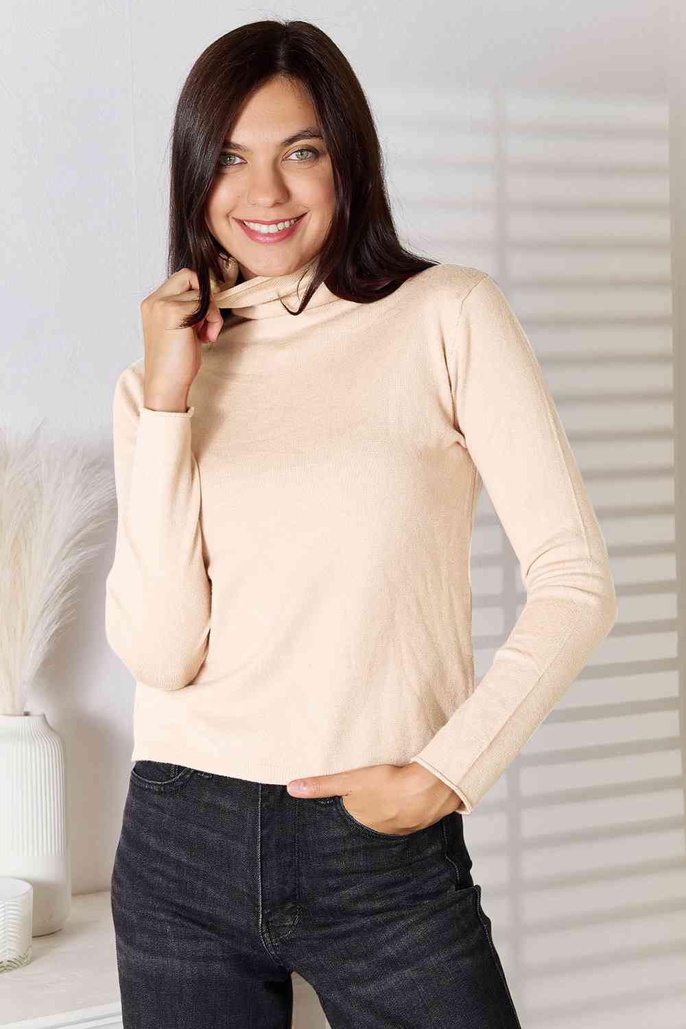 Stay cozy and stylish in our Turtleneck Long Sleeve Knit Top. Essential knitwear made from a blend of viscose and wool. Slightly stretchy for comfort. Machine washable. Available in sizes S to 2XL.