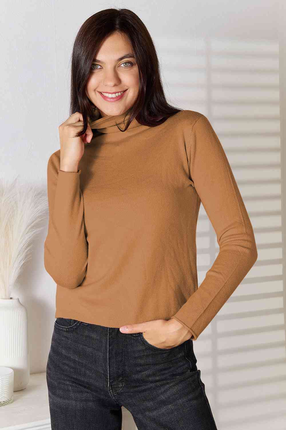 Stay cozy and stylish in our Turtleneck Long Sleeve Knit Top. Essential knitwear made from a blend of viscose and wool. Slightly stretchy for comfort. Machine washable. Available in sizes S to 2XL.