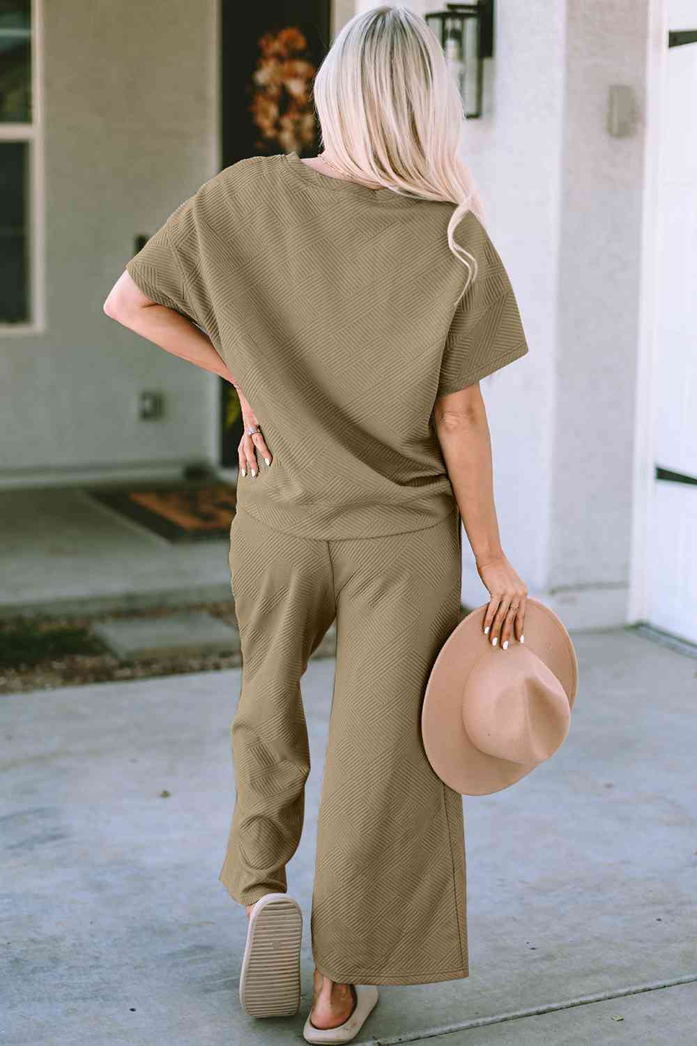 Stay comfortable and stylish in our Short Sleeve Top and Pants Set. Two-piece lounge wear made from a blend of polyester and spandex. Features a drawstring for a customizable fit. Available in sizes S to 2XL.