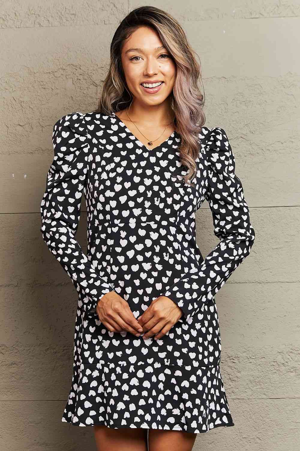 Printed V-Neck Puff Sleeve Mini Dress - Elegance in every detail. Charming print, ruffle details, and long puff sleeves. A-line silhouette in a slightly stretchy fabric blend. Perfect for a classy and effortless look.